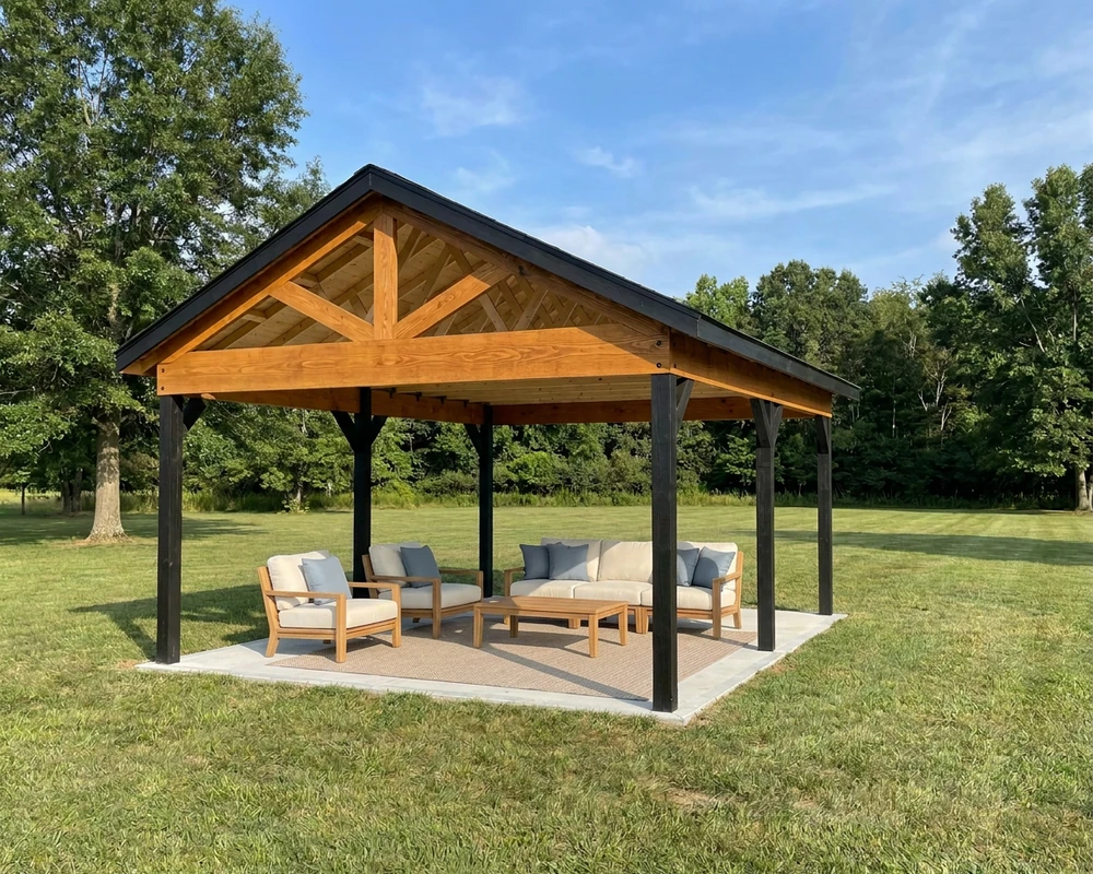 16×20 backyard pavilion with black posts, a stained timber gable and a lounge set on a concrete patio